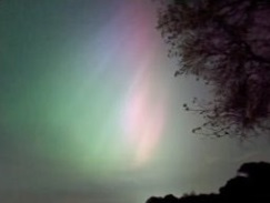 The photo shows a rippled radiating aurora corona overhead towards the horizon in Telford Shropshire UK